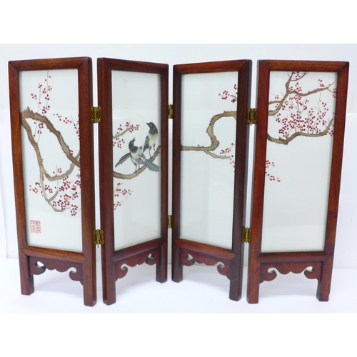 628 - A circa mid 20th Century Chinese table screen with embroidered silk panels, decorated with two magpi... 