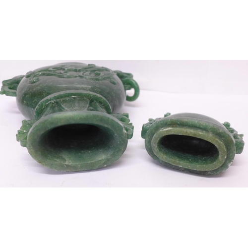 629 - A carved green stone urn with lid, small losses to the lid and one ring missing, 23cm