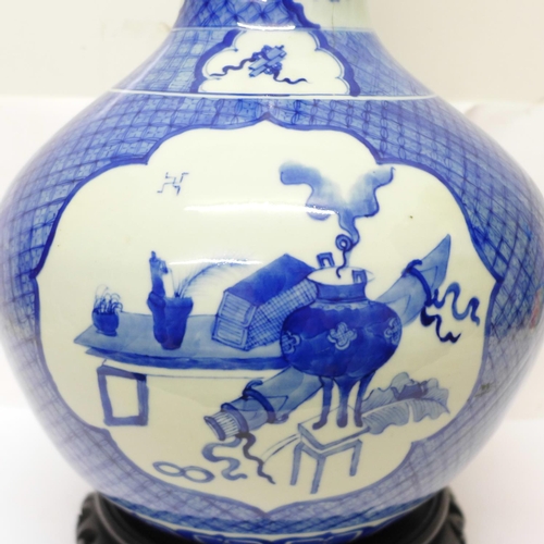 632 - A Chinese blue and white bottle vase, six character mark to the base, a/f crack on the 'neck', with ... 