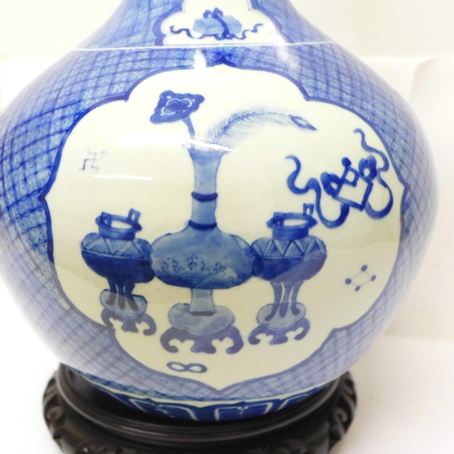 632 - A Chinese blue and white bottle vase, six character mark to the base, a/f crack on the 'neck', with ... 