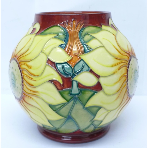 634 - A Moorcroft sunflower globular vase, dated '94, 17cm