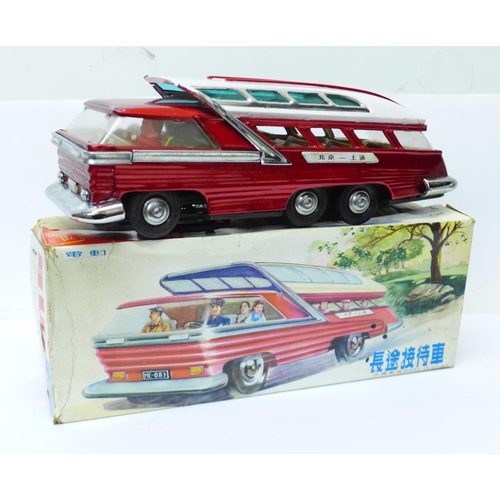 638 - A Chinese battery operated tin-plate Mystery Action Bus, 28cm, boxed