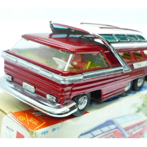 638 - A Chinese battery operated tin-plate Mystery Action Bus, 28cm, boxed