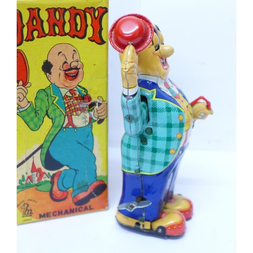 641 - A Mikuni tin-plate clockwork toy, Dandy Mechanical, made in Japan, 15cm, boxed