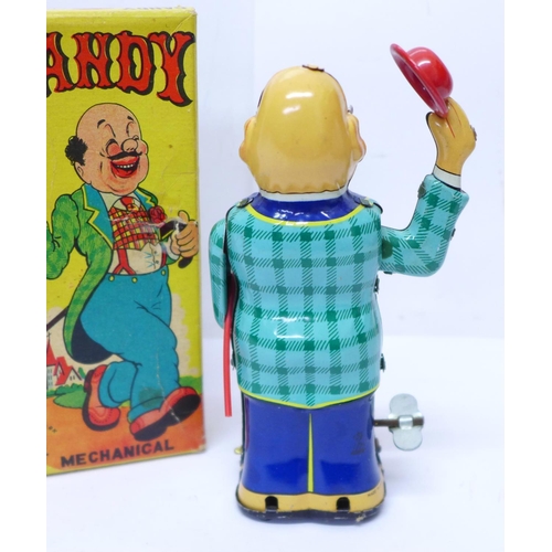 641 - A Mikuni tin-plate clockwork toy, Dandy Mechanical, made in Japan, 15cm, boxed