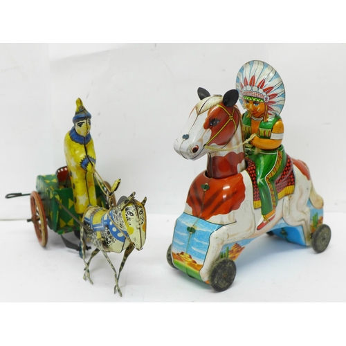 643 - A tin-plate clockwork clown and a T.T. made in Japan 'Indian' Chief on horse