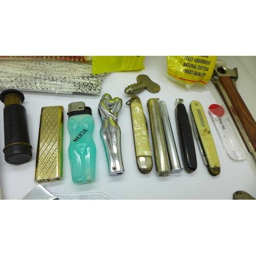 654 - A cigar cutter marked Solingen, pipe knives and cleaners, lighters, Dunhill lighter flints, etc.