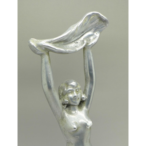 668 - An Art Deco figure, 25.5cm and a bottle opener