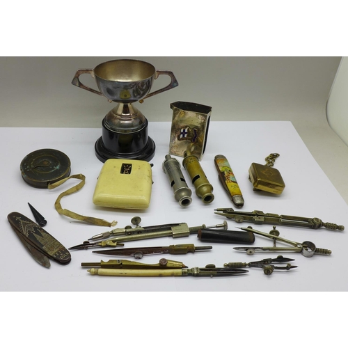 672 - A plated trophy, matchbox holder, two whistles, pocket knives, etc.