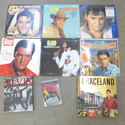 709 - Eight Elvis Presley LP records, a Graceland pop-up tour book, one other book and DVD