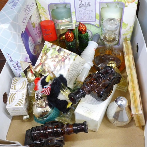 710 - A collection of perfume bottles including Avon, boxed soaps, etc.