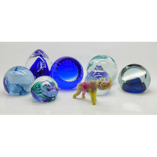 711 - A collection of glass paperweights including Caithness and a small glass rhinoceros