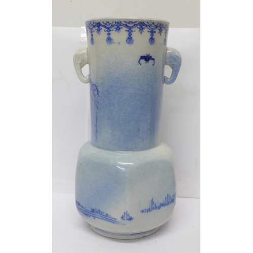 720 - A 19th Century Chinese blue and white vase with six character mark to the base, 21cm