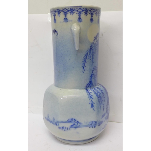 720 - A 19th Century Chinese blue and white vase with six character mark to the base, 21cm