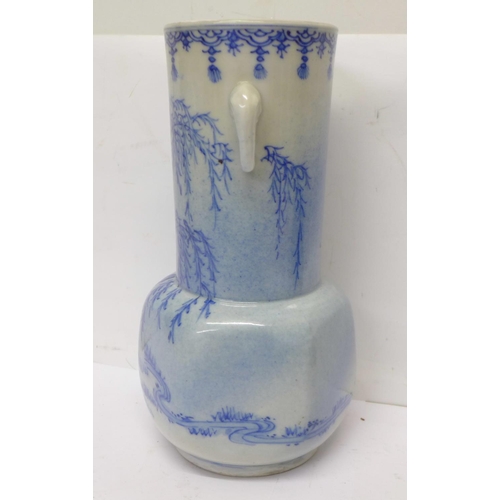 720 - A 19th Century Chinese blue and white vase with six character mark to the base, 21cm