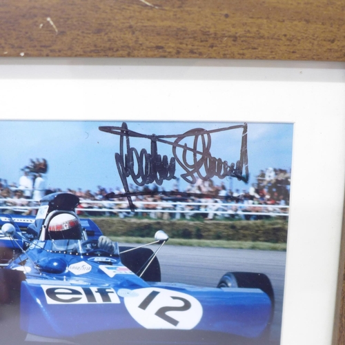 722 - A framed photograph of Jackie Stewart, signed