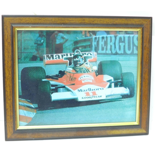 726 - A framed photograph of James Hunt, signed