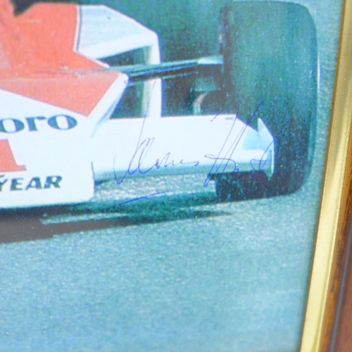 726 - A framed photograph of James Hunt, signed