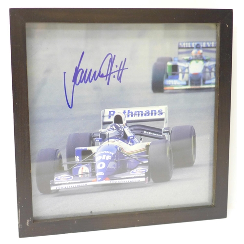 729 - A framed photograph of Damon Hill, signed