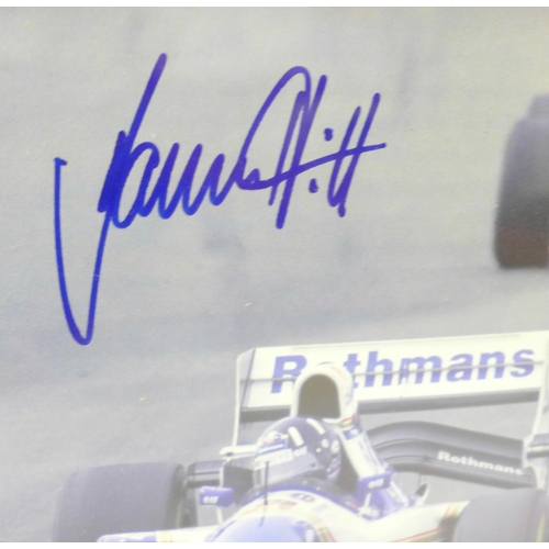 729 - A framed photograph of Damon Hill, signed