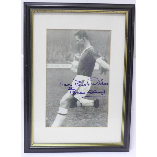 730 - A framed photograph of Brian Clough playing for Middlesbrough, signed