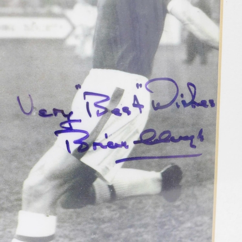 730 - A framed photograph of Brian Clough playing for Middlesbrough, signed