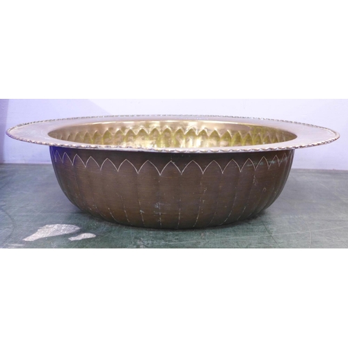 794 - A large Eastern brass bowl with emblems, 47cm