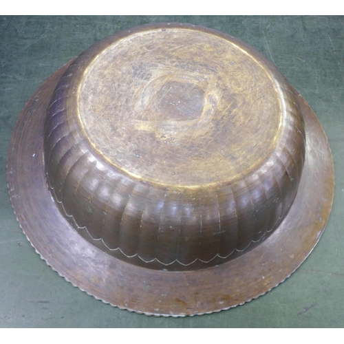 794 - A large Eastern brass bowl with emblems, 47cm