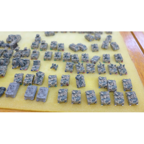 795 - Nine cases with a large collection of 6mm 1/300 scale table top war gaming armoured tanks and other ... 