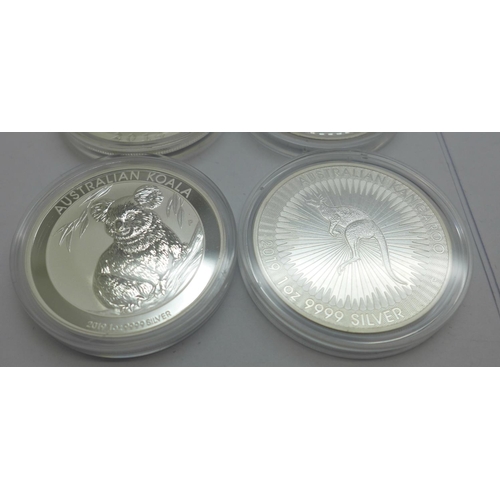 800J - Four silver coins, each 1oz. .999 fine silver; 2019 Britannia £2 coin, 2014 10 yuan Panda coin, 2019... 