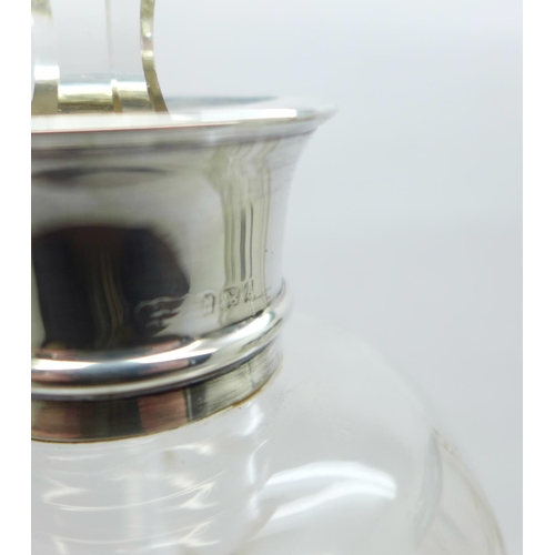 802 - A silver mounted decanter, a/f, and an etched glass tankard