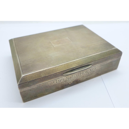 806 - A silver cigarette box, with inscription dated 1962, 113mm wide