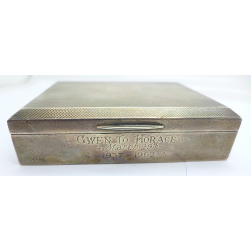 806 - A silver cigarette box, with inscription dated 1962, 113mm wide