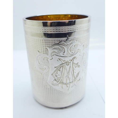 813 - A white metal goblet with monogram and gilt interior, with case, marked 750H, 136g