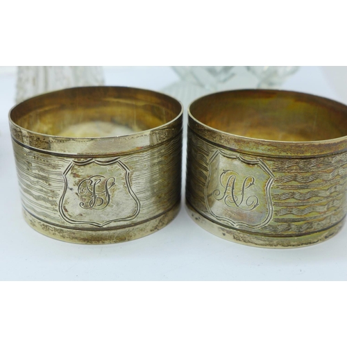 814 - A Georgian silver salt, a set of six silver napkin rings, three other silver napkin rings, a silver ... 