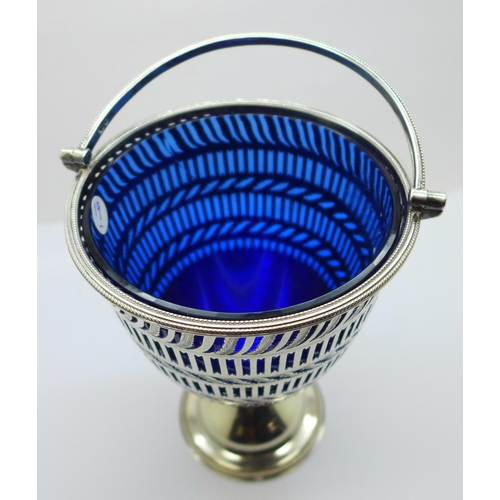 816 - A Victorian pierced silver basket with blue glass liner, London 1894, West & Son, 277g, 144mm