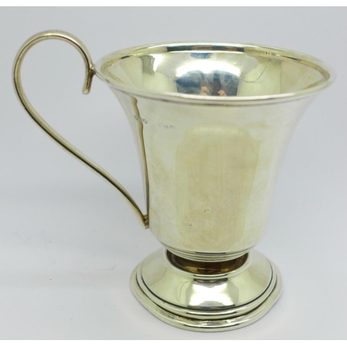 821 - A silver christening mug, 94.9g, a/f, dented, base out of shape