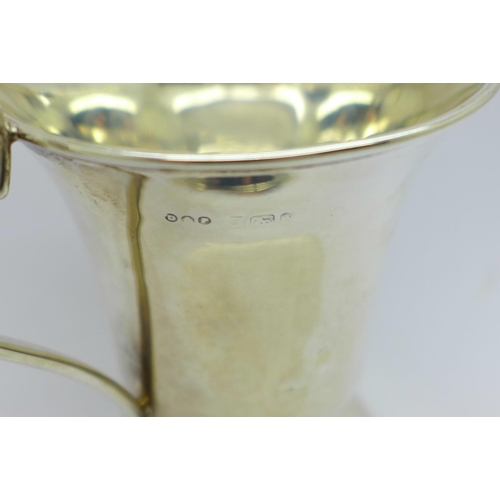 821 - A silver christening mug, 94.9g, a/f, dented, base out of shape