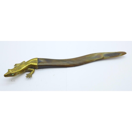 824 - A brass and horn letter opener in the form of a salamander, with jade eyes, horn a/f