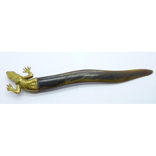 824 - A brass and horn letter opener in the form of a salamander, with jade eyes, horn a/f