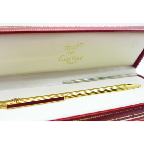 825 - A Must de Cartier ballpoint pen, with box and paperwork