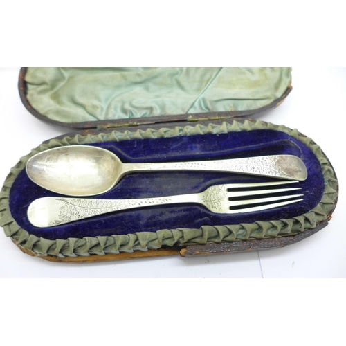 830 - A Victorian silver fork and spoon christening set, cased, and a set of three silver condiment spoons... 