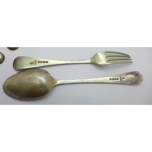 830 - A Victorian silver fork and spoon christening set, cased, and a set of three silver condiment spoons... 