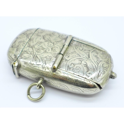 838 - A plated combination vesta case, sovereign holder and stamp holder