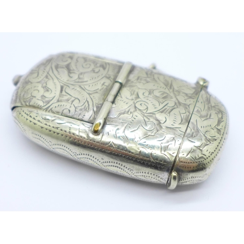 838 - A plated combination vesta case, sovereign holder and stamp holder