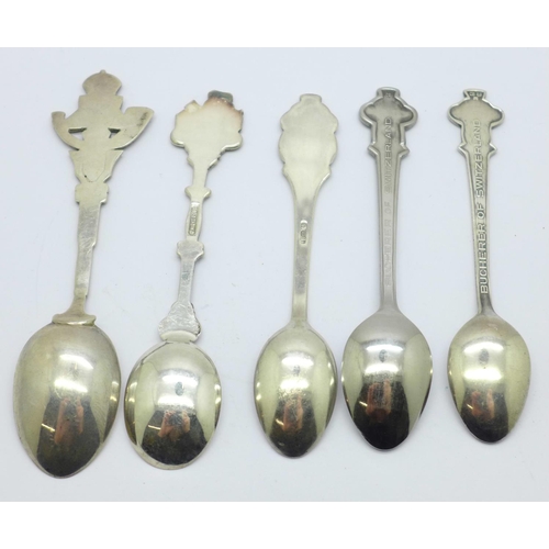 839 - Three Rolex spoons, a silver spoon and one other spoon