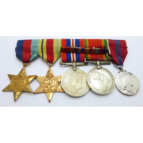 849 - A set of four WWII medals including Africa Service Medal and a Queen Elizabeth II Coronation medal t... 