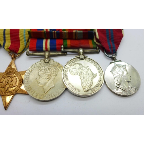 849 - A set of four WWII medals including Africa Service Medal and a Queen Elizabeth II Coronation medal t... 