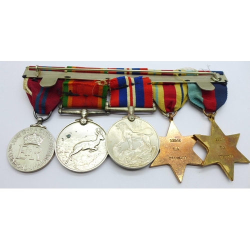 849 - A set of four WWII medals including Africa Service Medal and a Queen Elizabeth II Coronation medal t... 