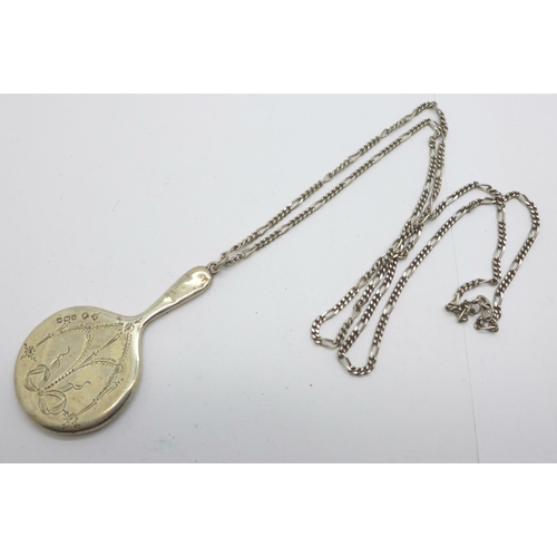 856 - A miniature silver hand mirror, Birmingham 1921, on a silver chain